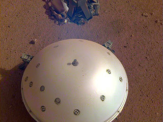 This image shows InSight's domed Wind and Thermal Shield, which covers its seismometer. The image was taken on the 110th Martian day, or sol, of the mission. The seismometer is called Seismic Experiment for Interior Structure, or SEIS.