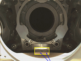An annotated GIF depicts a rotational test of Perseverance’s bit carousel in which two of four rock fragments were ejected. The five images that make up the GIF were obtained by the rover’s WATSON imager on Jan. 17, 2022.