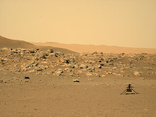 This image was taken by the Perseverance rover with the Mars Helicopter Ingenuity on the surface of Mars at the location, "Airfield D" (the fourth airfield), east of the "Séítah" geologic unit. 