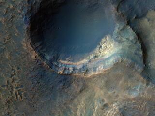 This image acquired on January 22, 2022 by NASAs Mars Reconnaissance Orbiter shows some steep slopes with good exposures of the bedrock layers, revealing diverse color and textures.