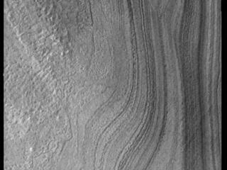 This image from NASAs Mars Odyssey shows layering in the south polar cap. The layers are formed over thousands of years of seasonal change, reflecting ice and dust surface deposition.