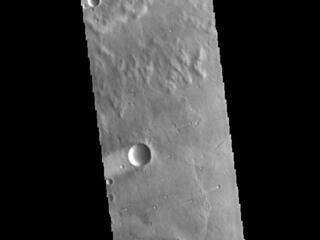 This image from NASAs Mars Odyssey shows windstreaks located in Syrtis Major Planum.